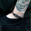 Kokosnuss-Armbänder mit Slogan – Rebellion X